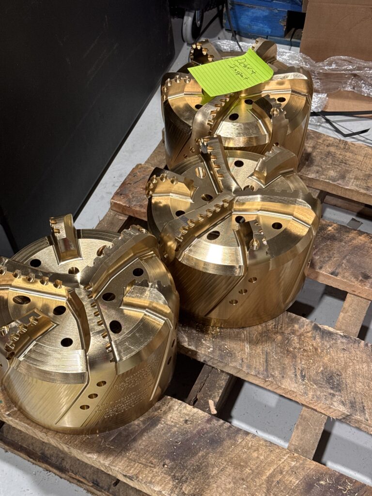 3 nickel aluminum bronze drill shoes prepared for shipment on a pallet